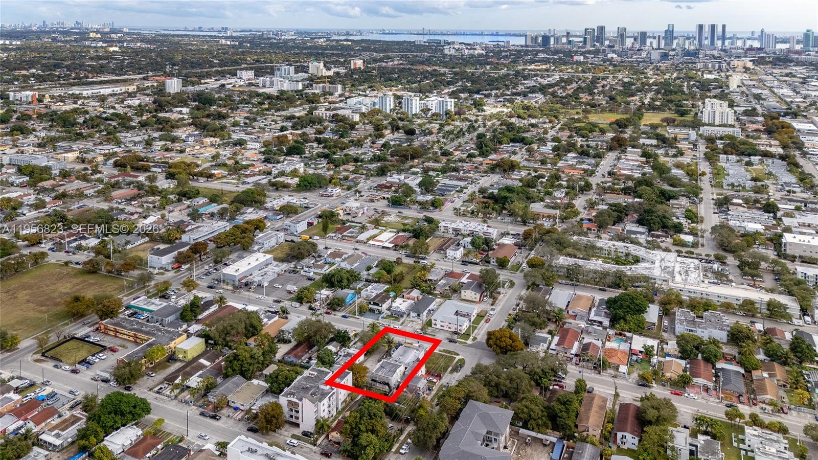 An aerial view shows a residential property outlined in red within a dense urban neighborhood — 2610 NW 23rd Ave, Miami FL 33142, MIAMI, FL