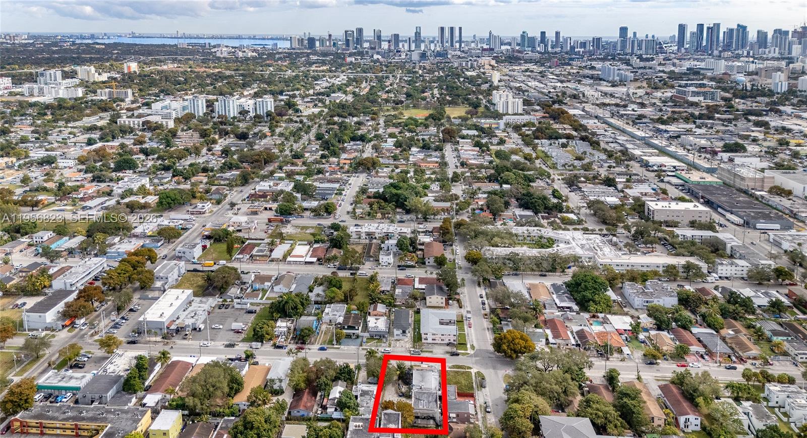 An aerial view shows a residential property outlined in red within a dense urban neighborhood — 2610 NW 23rd Ave, Miami FL 33142, MIAMI, FL