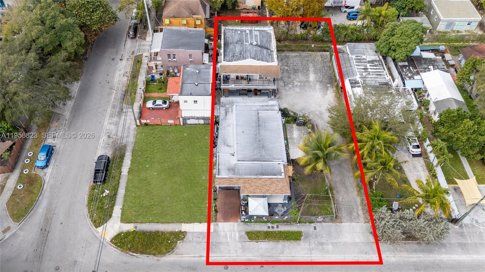 An aerial view shows a rectangular property lot containing two buildings and a parking area — 2610 NW 23rd Ave, Miami FL 33142, MIAMI, FL