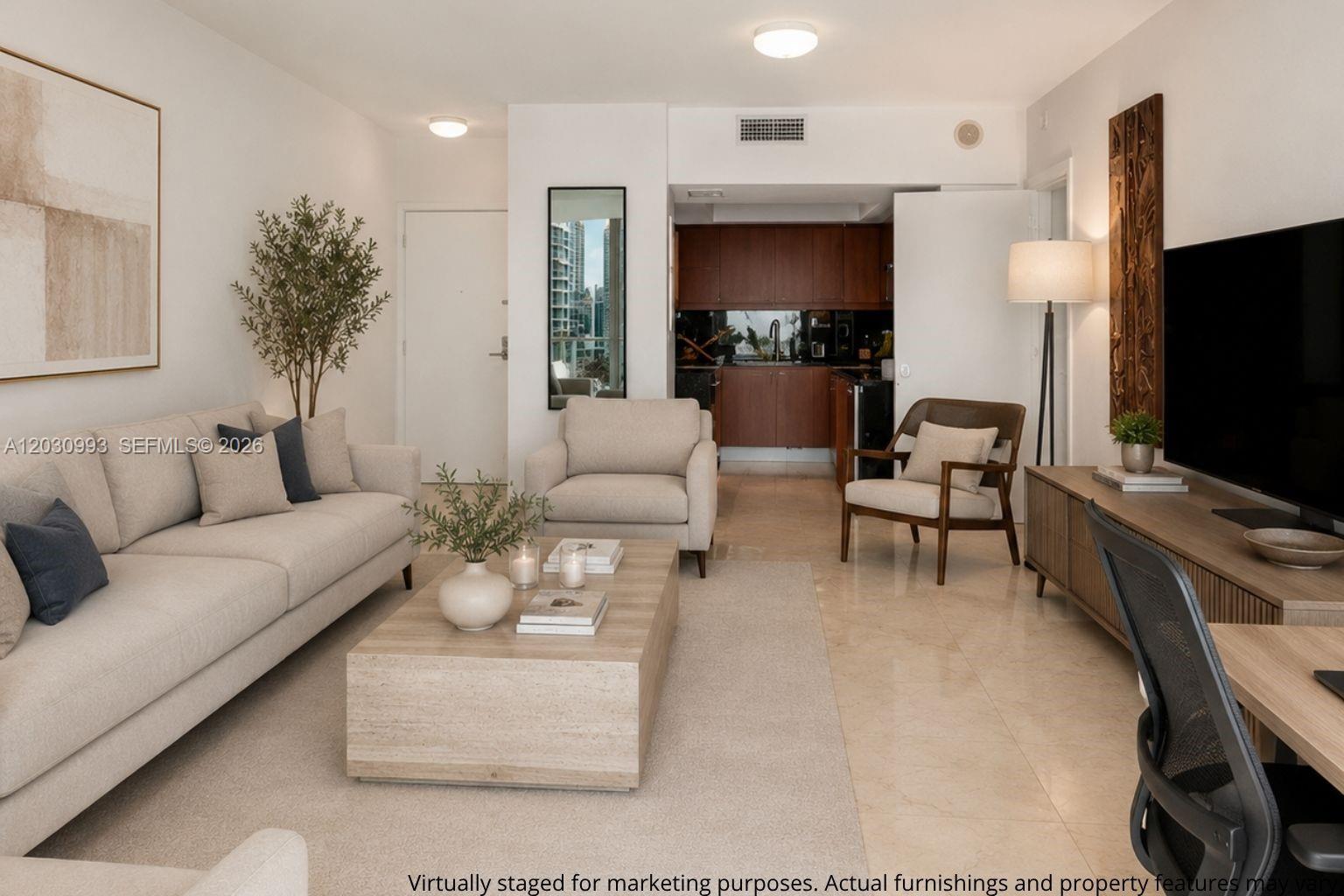 This virtually staged living room features a sofa, armchairs, coffee table, and an open kitchen — 1331 BRICKELL BAY DR # 1004, Miami FL 33131, MIAMI, FL