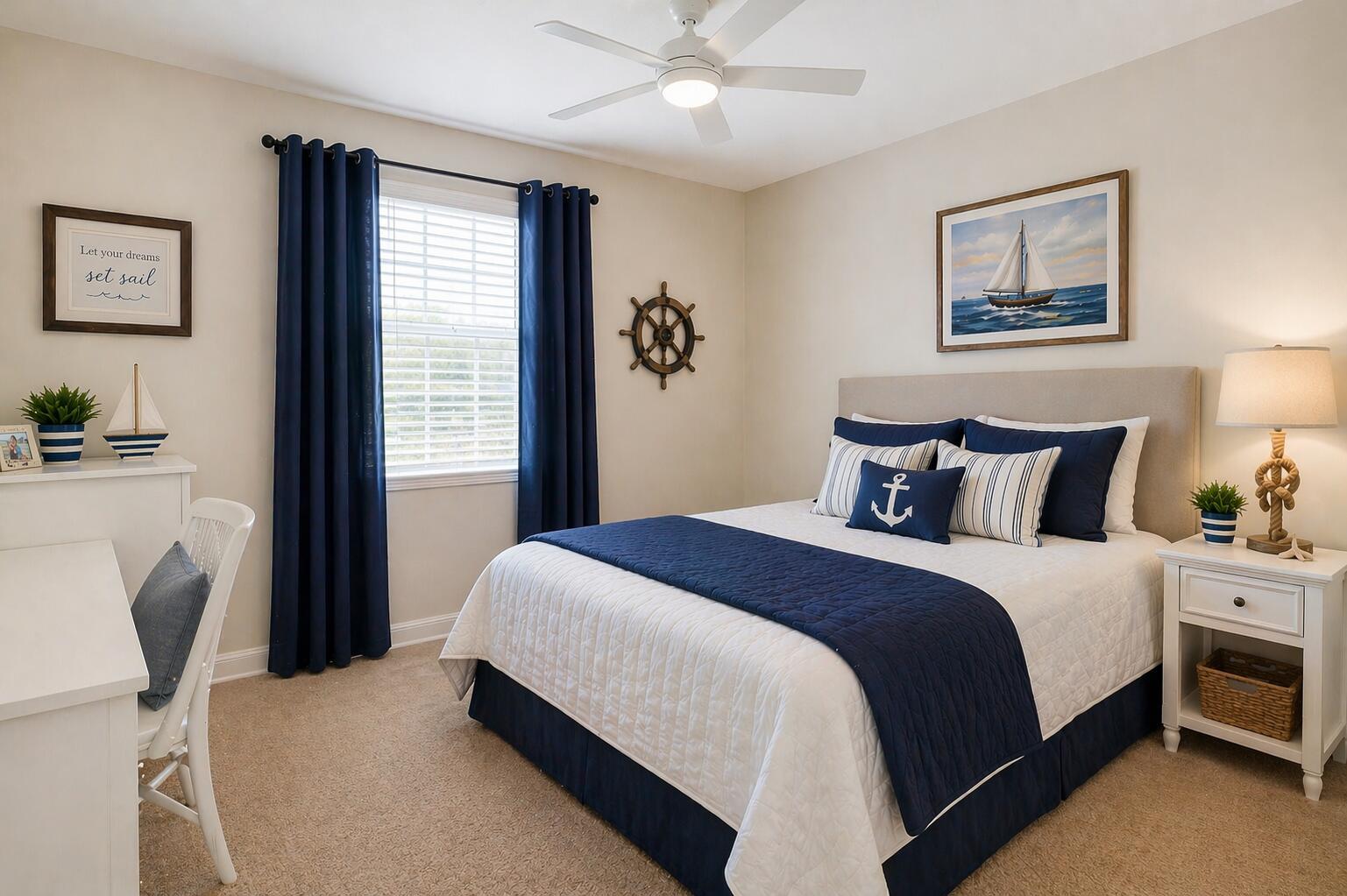 A nautical-themed bedroom features a bed with blue bedding, a desk, and a window — 9503 SW Merlin Court, Stuart FL 34997, STUART, FL