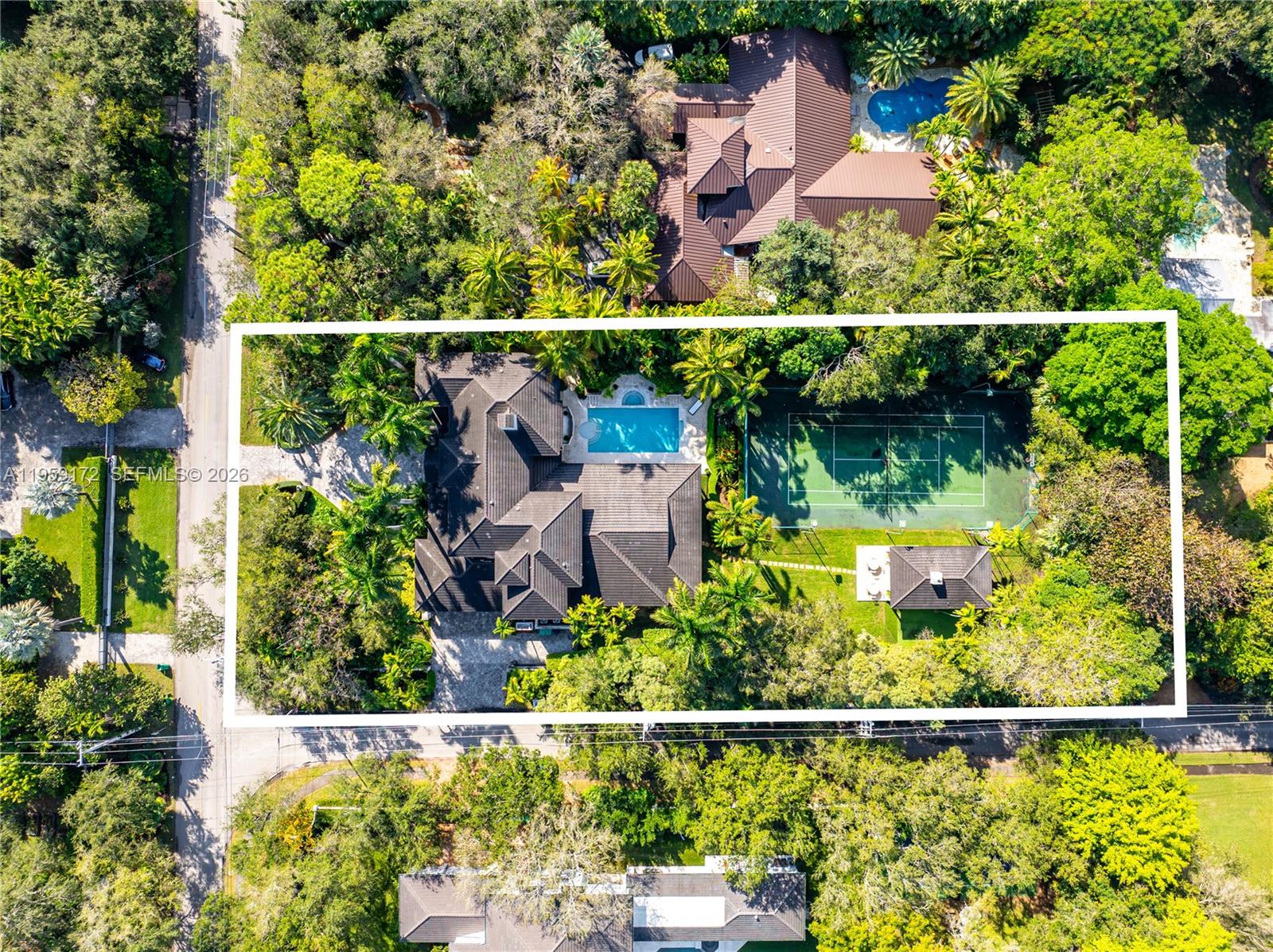 An aerial view shows a house with a swimming pool and tennis court — 8400 SW 52nd Ave, Miami FL 33143, MIAMI, FL