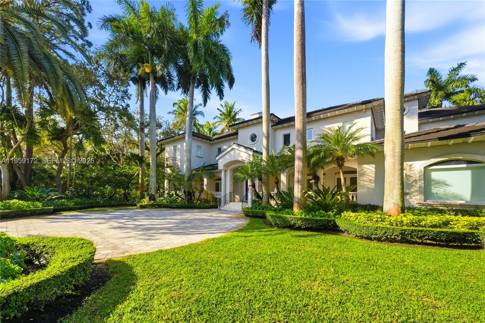 A two-story stucco house with a paved driveway and tall palm trees in the front — 8400 SW 52nd Ave, Miami FL 33143, MIAMI, FL