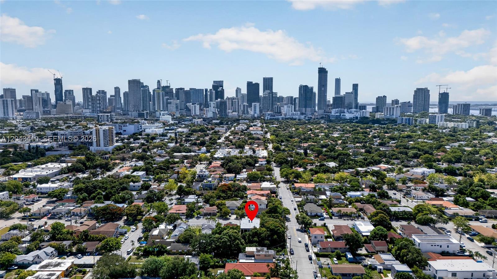 An aerial view shows a residential neighborhood with a red location pin on a house — 1032 SW 11th Ave, Miami FL 33130, MIAMI, FL