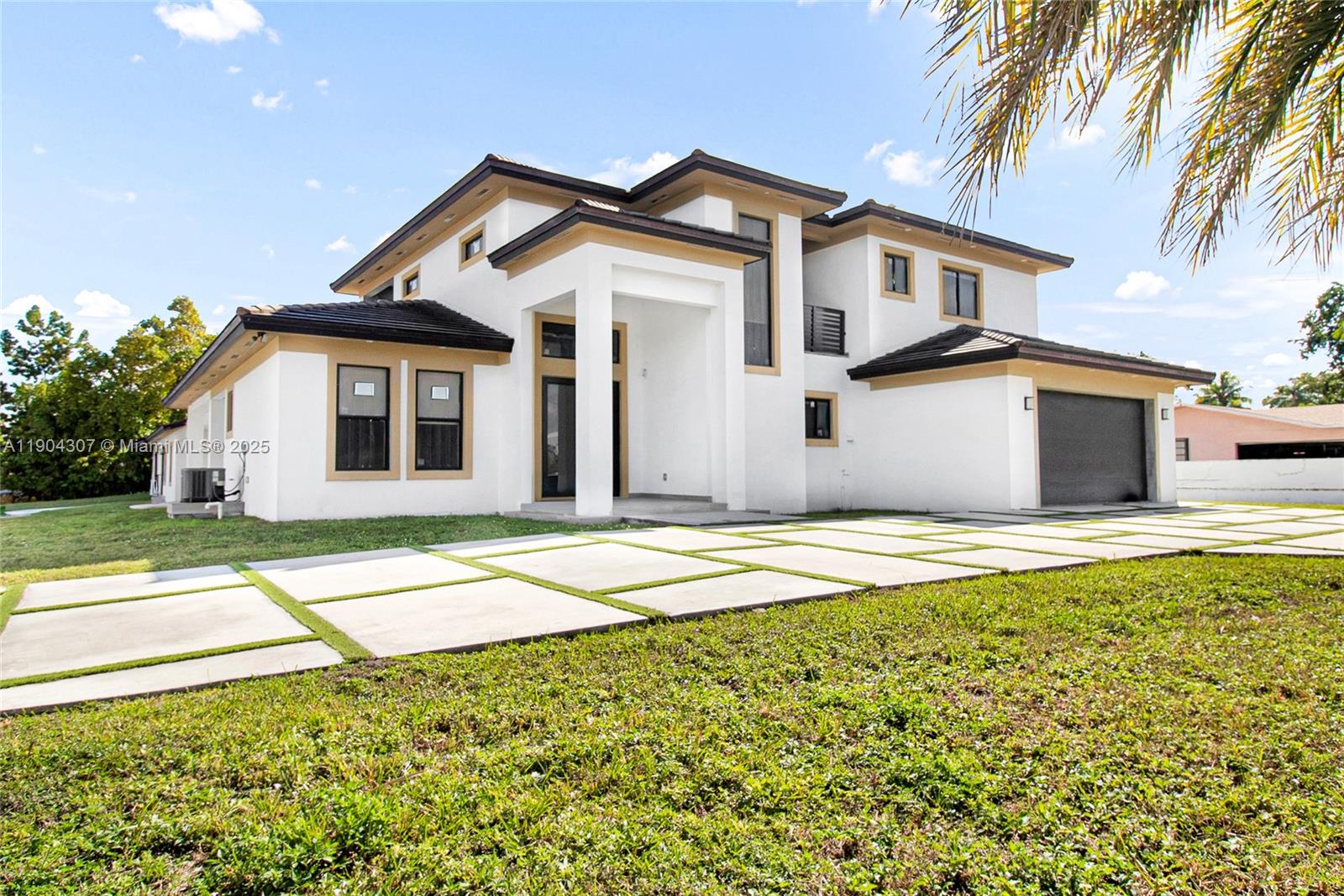 A modern two-story white house with a paved driveway and a dark garage door — 12890 NW 2nd St, Miami FL 33182, MIAMI, FL