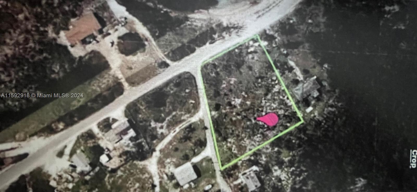 This aerial map shows a vacant, rectangular plot of land outlined in green — DOCTORS CREEK JPOSIAH TANTAILS, LONG ISLAND BAHAMAS, NA, NA