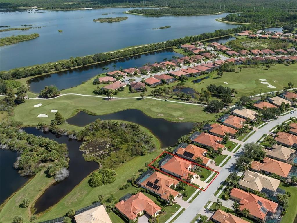 An aerial view shows a residential neighborhood with a red-outlined house near a golf course — 194 MONTELLUNA DRIVE, NORTH VENICE, FL