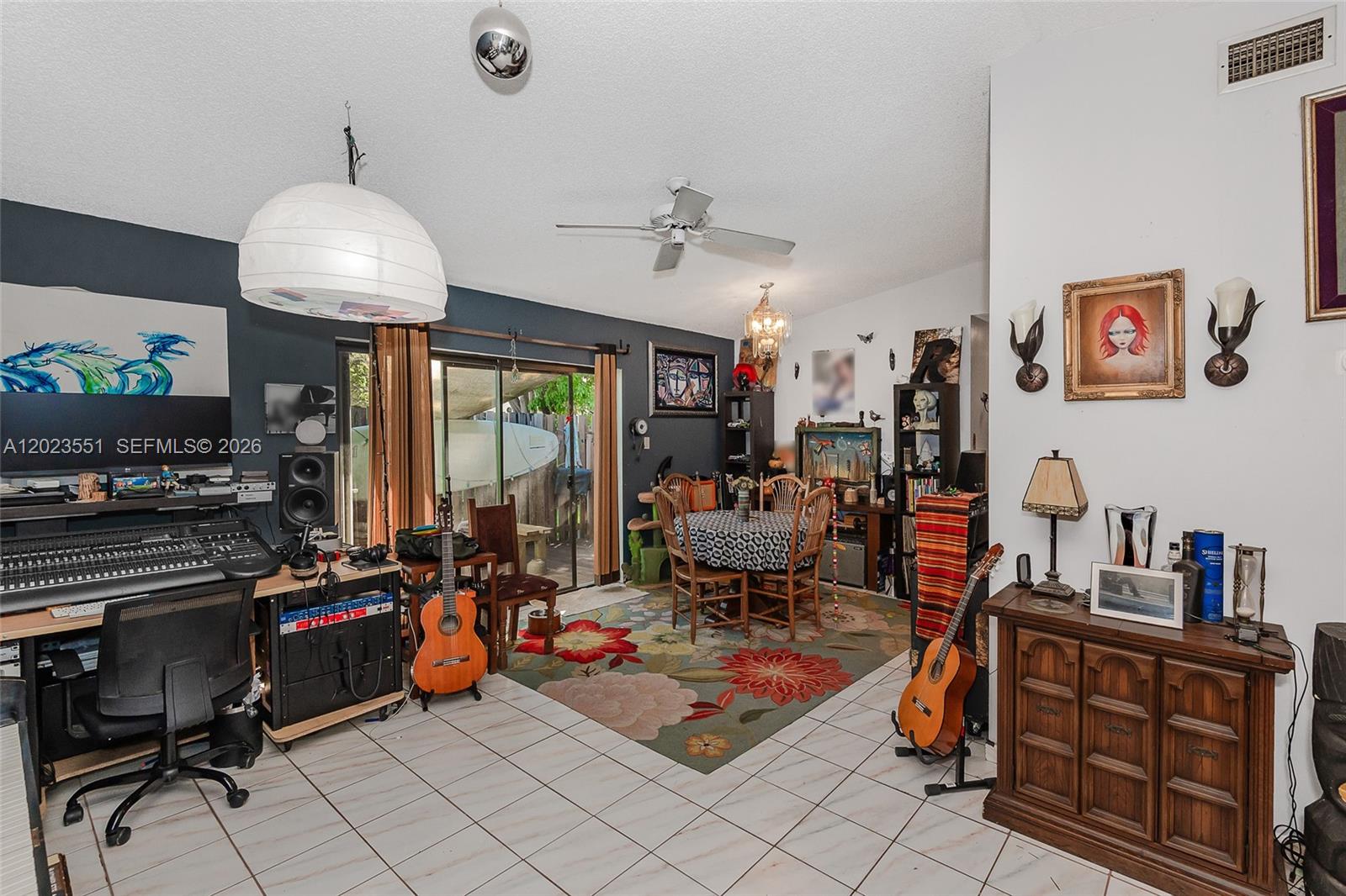 A living area features a music studio workstation, a dining set, and two acoustic guitars — 11482 SW 109th Rd # 29A, Miami FL 33176, MIAMI, FL