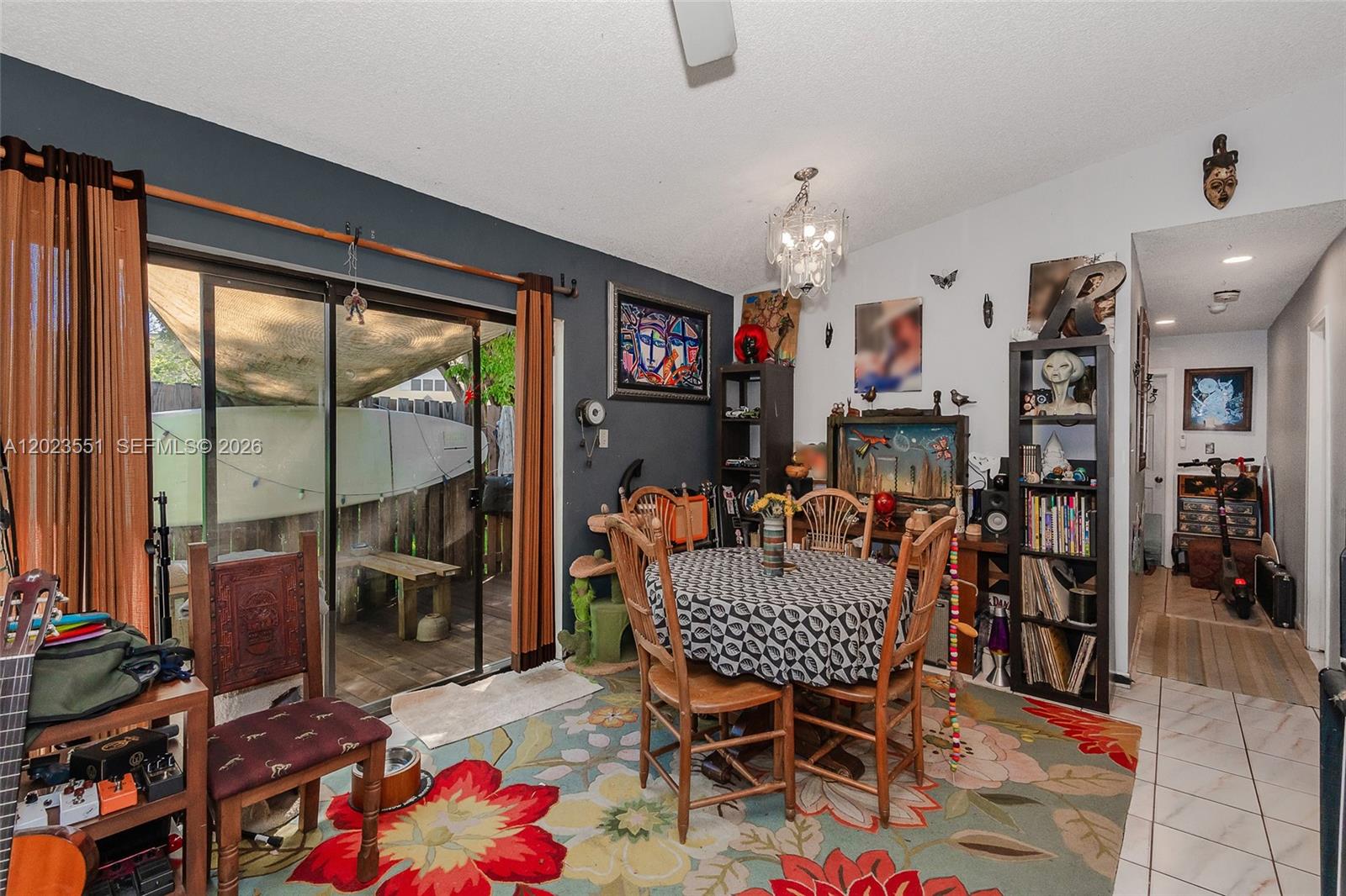 An open-concept dining area and home office feature tile flooring, a ceiling fan, and artwork — 11482 SW 109th Rd # 29A, Miami FL 33176, MIAMI, FL