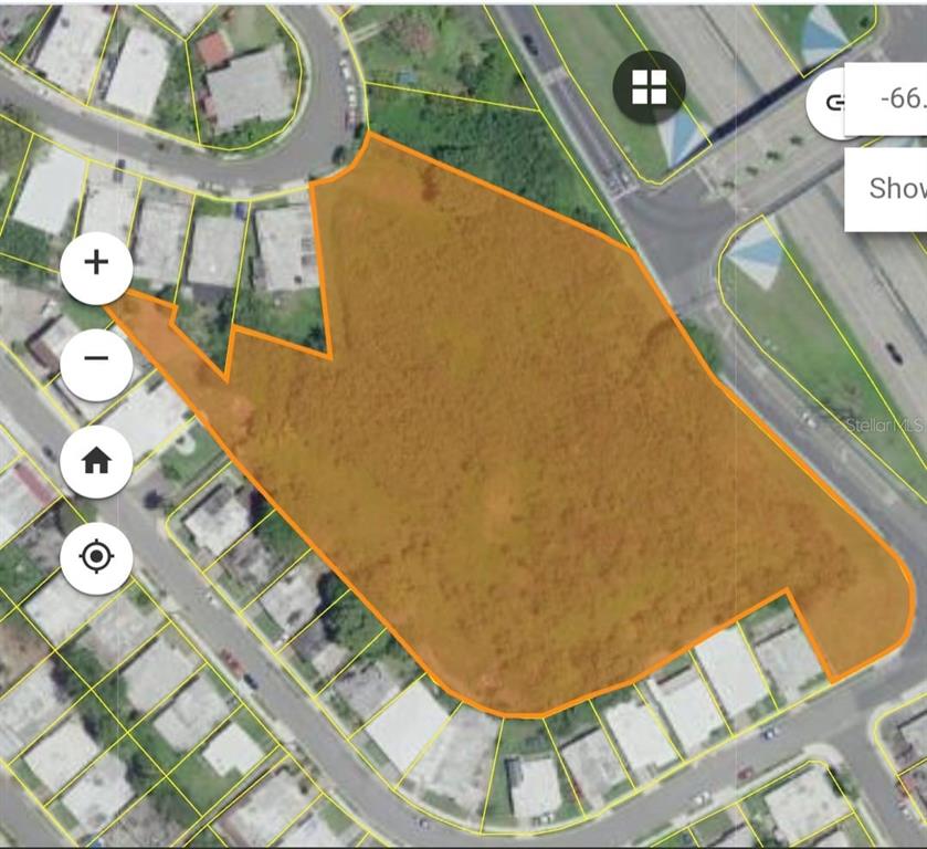 An aerial map view shows a large, vacant, irregularly shaped plot of land highlighted in orange — Calle F URB MELENDEZ, FAJARDO, PR