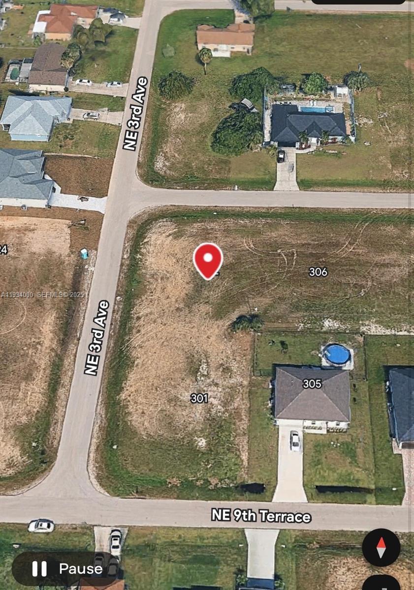 This aerial map shows a vacant corner lot located at the intersection of two streets — 302 NE 10 ST, Cape Coral FL 33909, CAPE CORAL, FL