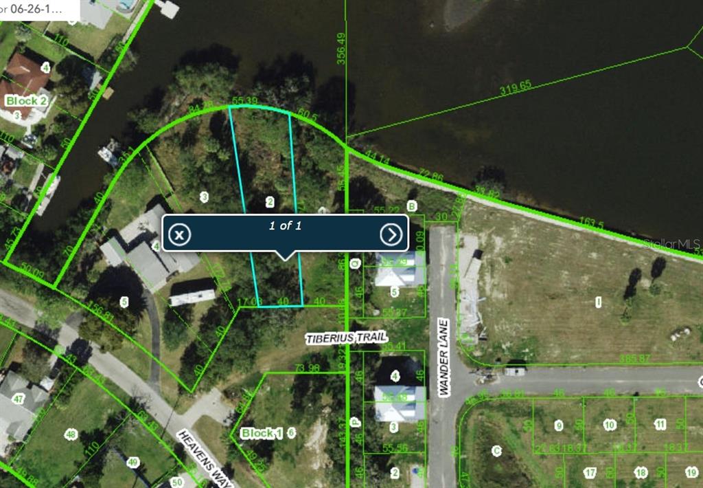 This is an aerial map showing property lot lines and parcel numbers in a residential area — TIBERIUS TRAIL, NEW PORT RICHEY, FL