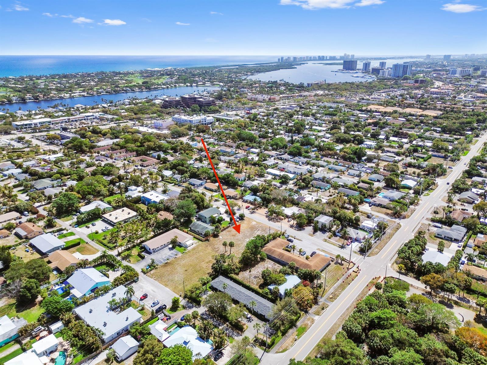 An aerial view shows a vacant lot in a residential neighborhood near the coast — 1955 Juno Road, North Palm Beach FL 33408, NORTH PALM BEACH, FL