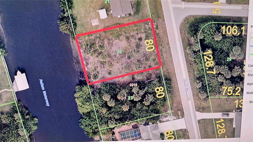 This is an aerial map showing a vacant residential lot highlighted in red — 3173 ROCK CREEK DRIVE, PORT CHARLOTTE, FL