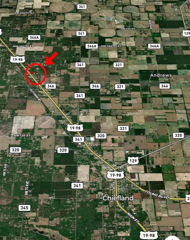 This is a satellite map showing a property location marked with a red circle — 14621 NW HIGHWAY 19, CHIEFLAND, FL