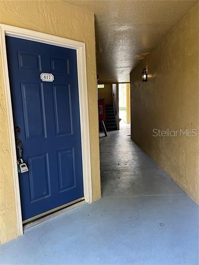 A kitchen with granite countertops and a dining area with a chandelier — 5124 CONROY ROAD UNIT 17, ORLANDO, FL