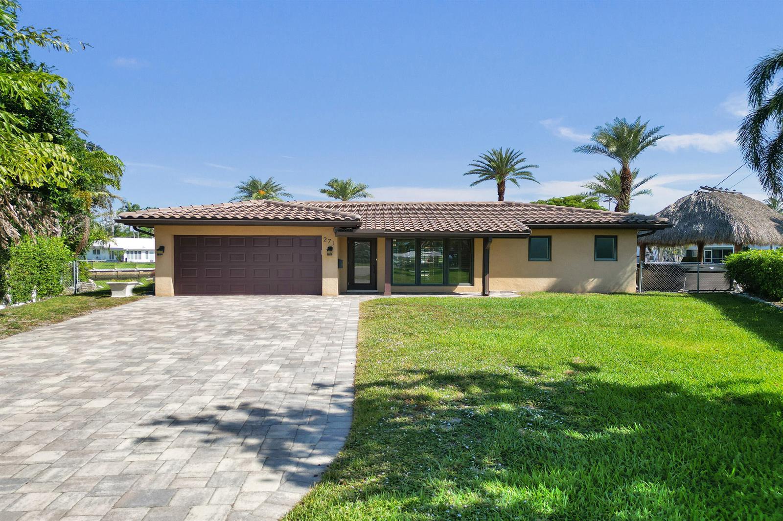 A single-story house with a brown tile roof, a paved driveway, and a grassy lawn — 271 SE 5th Terrace, Pompano Beach FL 33060, POMPANO BEACH, FL