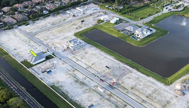 An aerial view shows a single house with a yellow arrow in a developing neighborhood — 5008 Naugle Way # 48, Davie FL 33328, DAVIE, FL