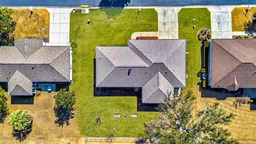 An aerial view shows a residential house with a shingled roof and surrounding lawn — 11335 SW 138TH LANE, DUNNELLON, FL