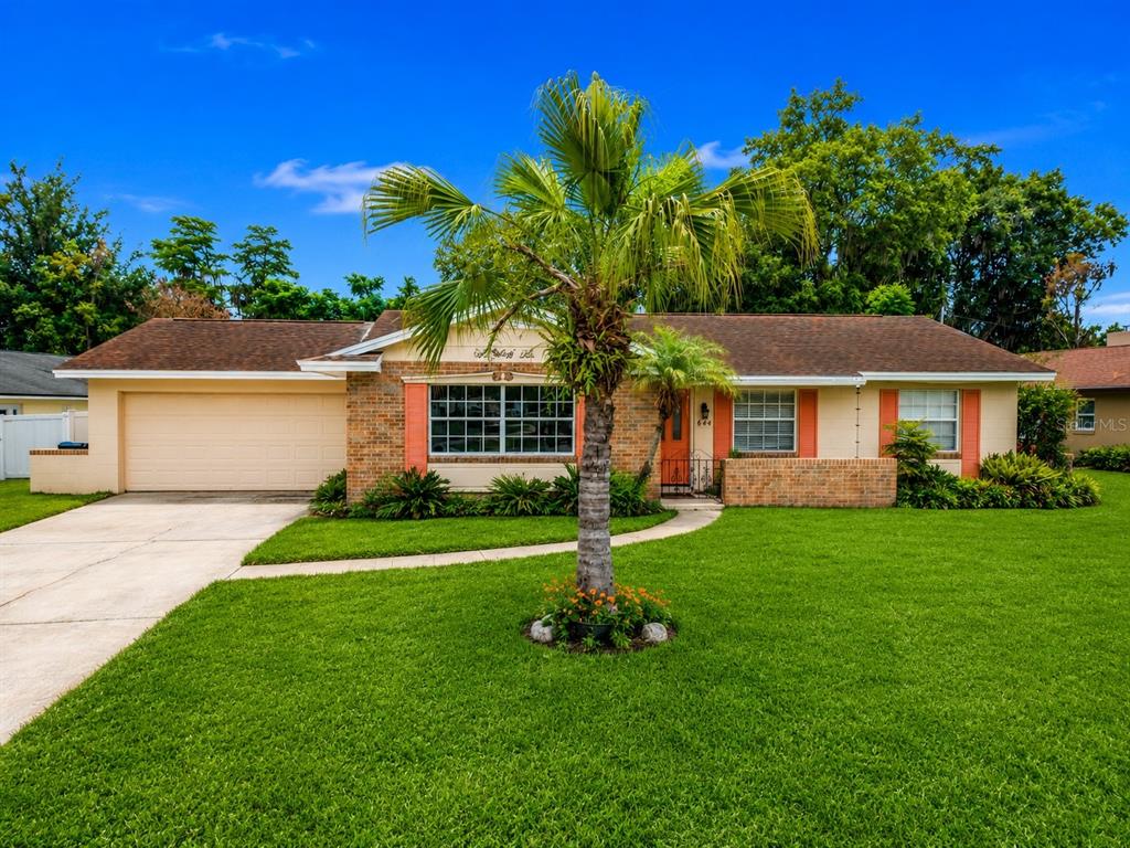 A single-story brick and stucco house with a palm tree in the front yard — 644 VISCAYA AVENUE, ORLANDO, FL