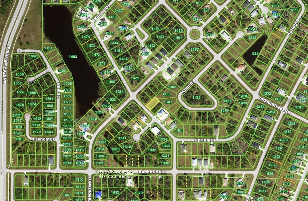 This is a map showing a residential neighborhood with houses, streets, and a lake — 207 SPRING DRIVE, ROTONDA WEST, FL