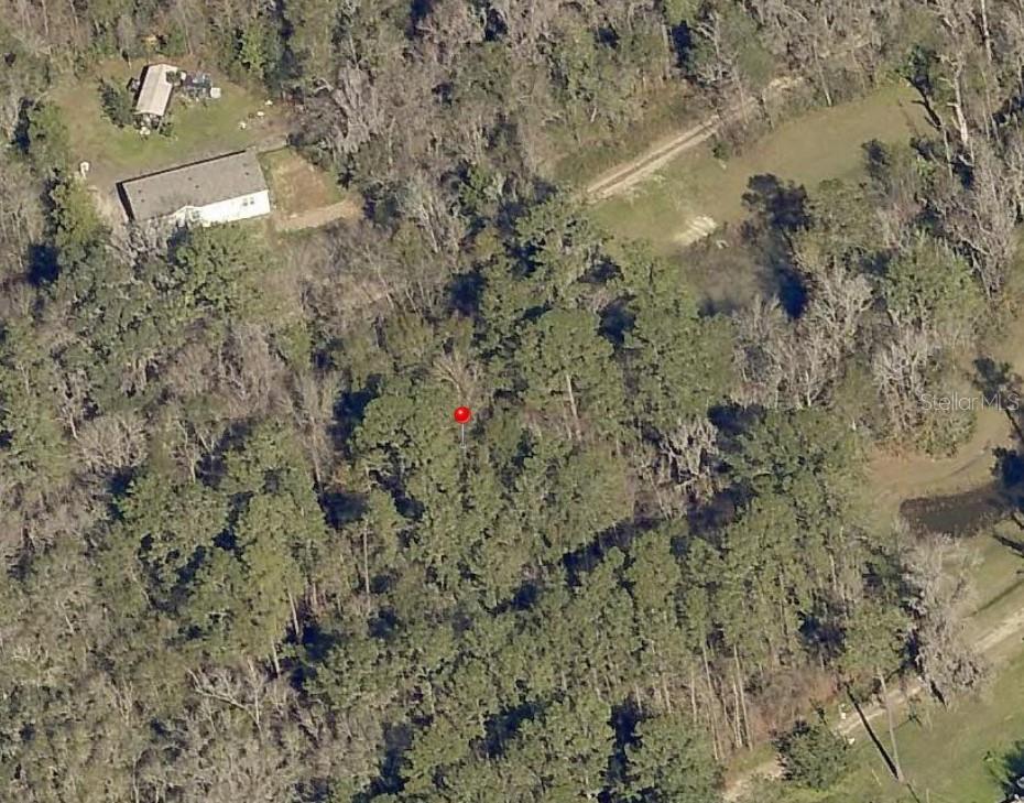 An aerial view shows a wooded lot with a red marker and a nearby house — TBD SW 16TH PLACE, OCALA, FL