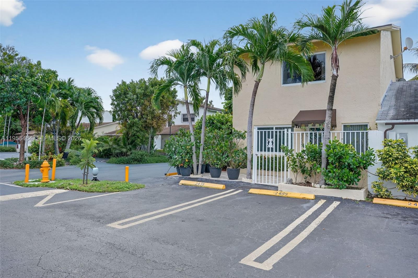A two-story building with palm trees and parking spaces in front — 2455 SW 11th St # A, Miami FL 33135, MIAMI, FL