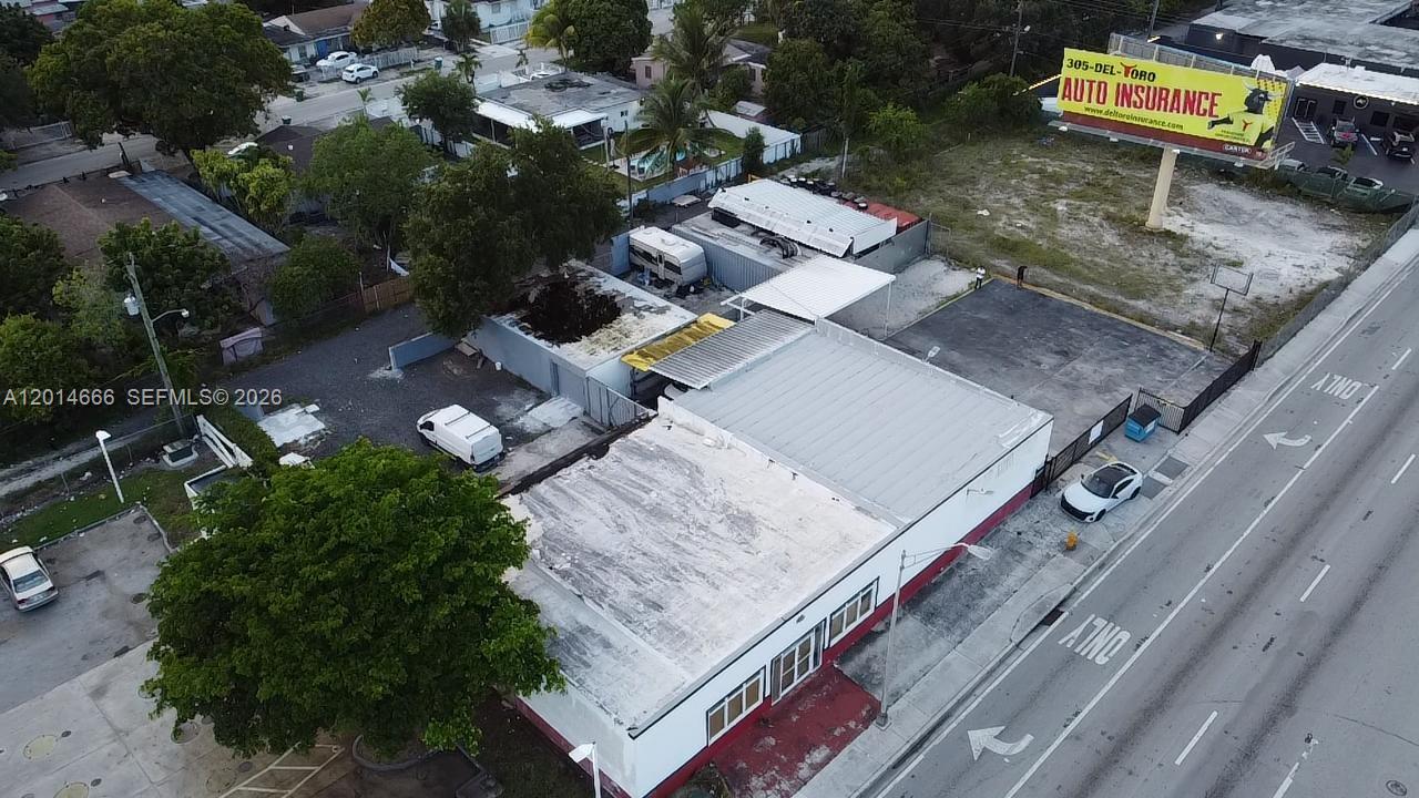 An aerial view shows a commercial building with a flat roof and an adjacent parking lot — 10342 NW 27th Ave, Miami FL 33147, MIAMI, FL