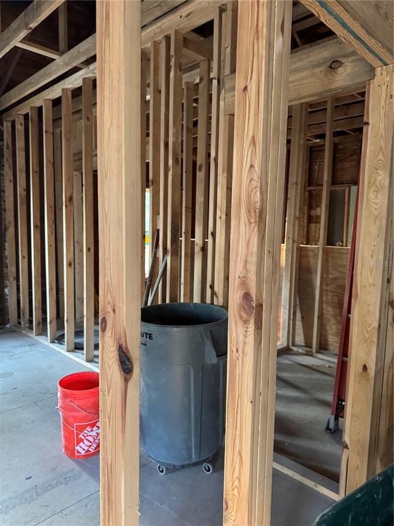 Interior view of a room under construction featuring exposed wooden wall studs and framing — 585 WASHINGTON STREET, NEW SMYRNA BEACH, FL