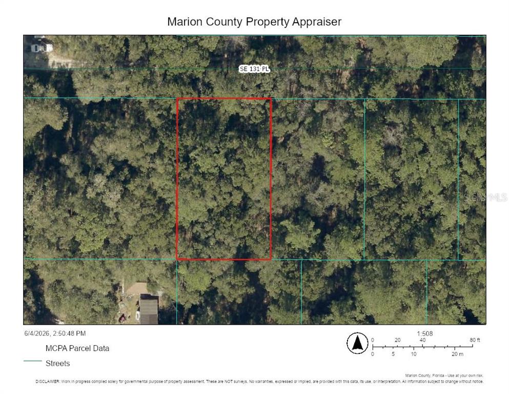 This is a property map showing a rectangular parcel of land outlined in red — Lots 7,8,9 SE 131ST PLACE, BELLEVIEW, FL